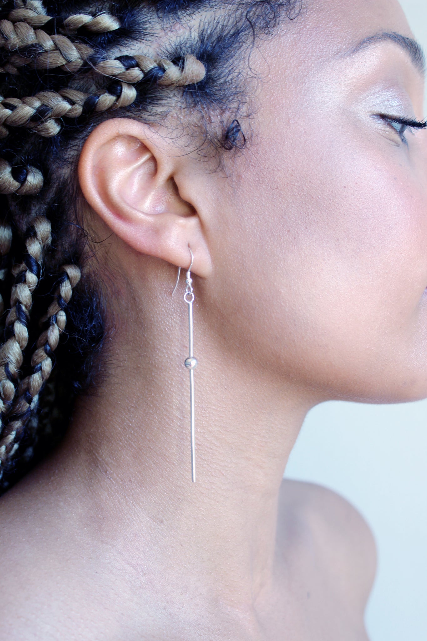 Dew-long-thin-earring-by-Marie-Beatrice-Gade-eco-jewellery-on-model