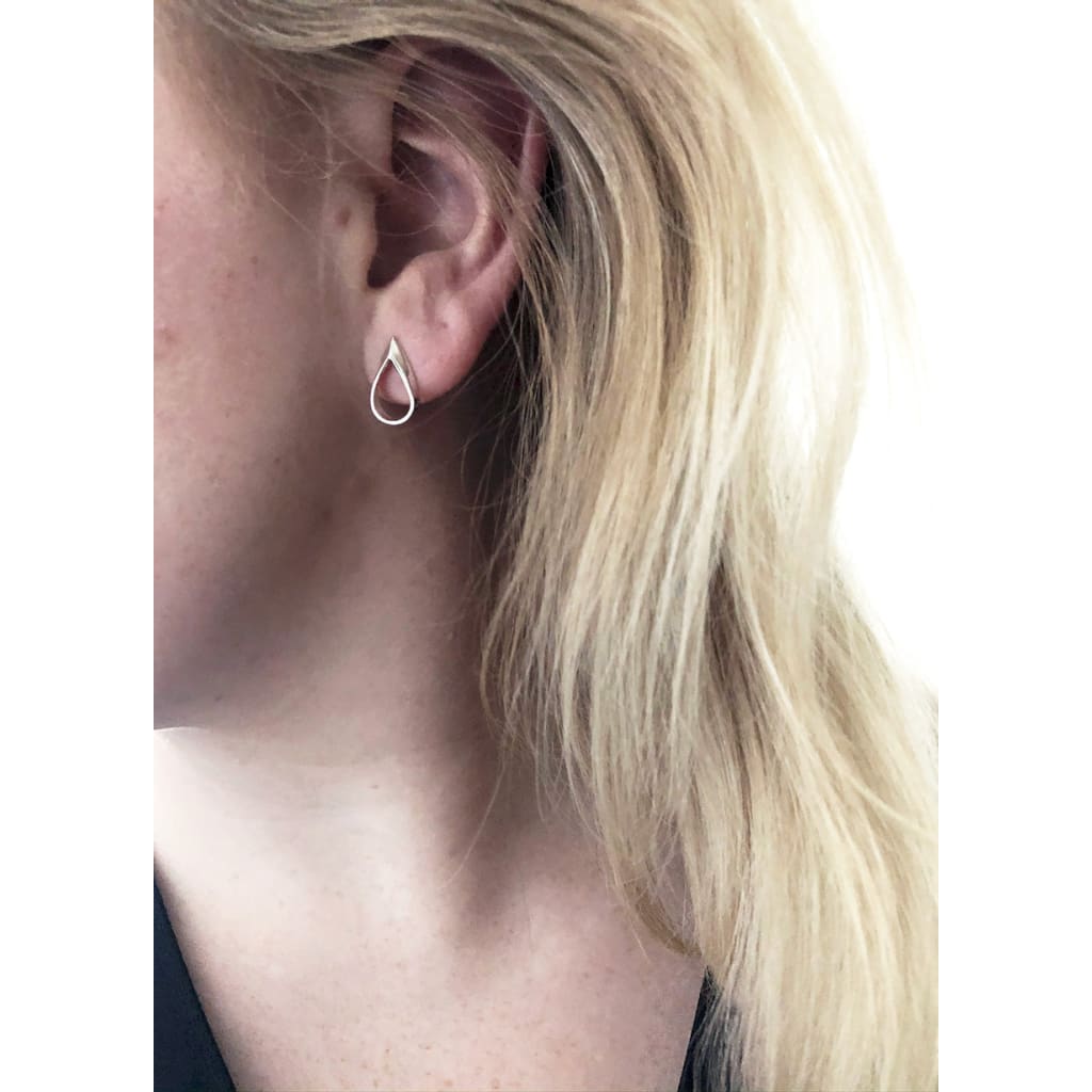 CLAIRE Mini Earrings - hollow teardrop-silver-earrings-on-model-by-Marie-B-Gade