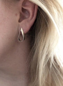 Claire-hollow-silver-teardop-earrings-in-recycled-925-sterling-silver-on-model
