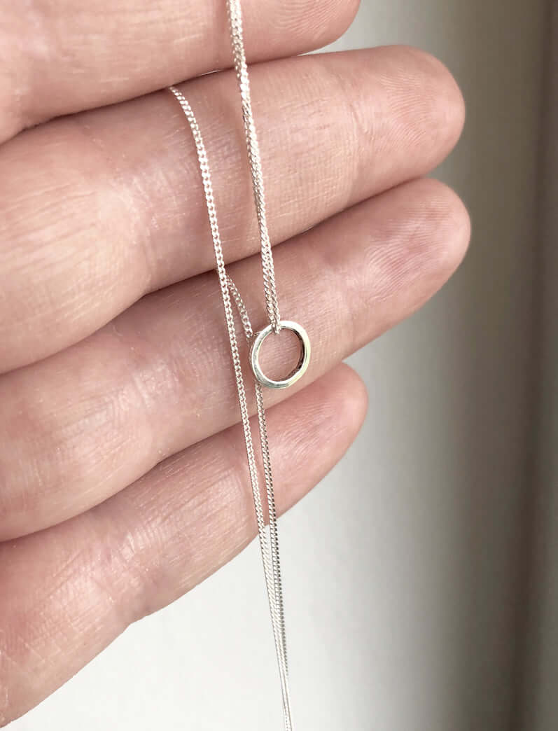 Continnum-necklace-in-recycled-sterling-silver-by-Marie-Beatrice-Gade-in-hand