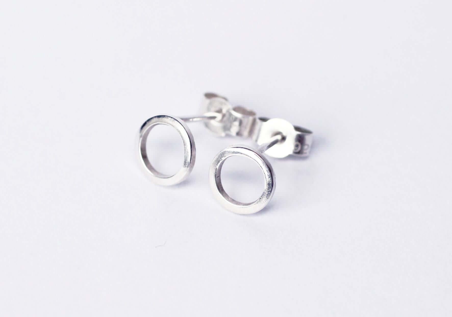 Continuum-silver-circle-stud-earrings-flatlay