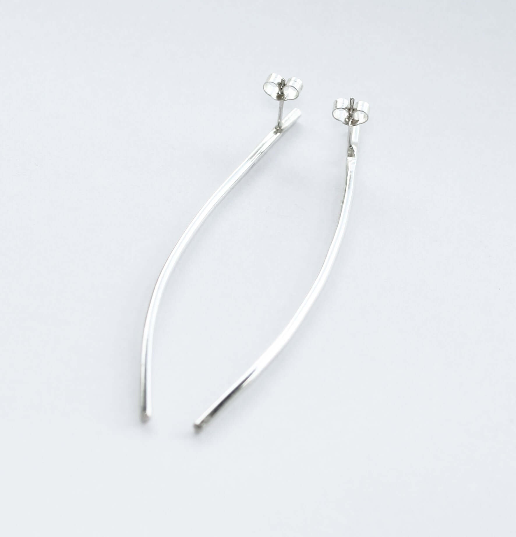 Curve-long-thin-earrings-by-Marie-Beatrice-Gade-on-white-background