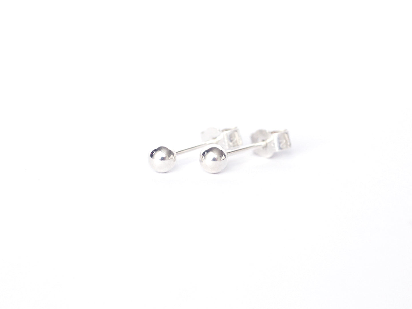Dew-drop-silver-bead-stud-earrings-by-Marie-Beatrice-Gade-on-white-background