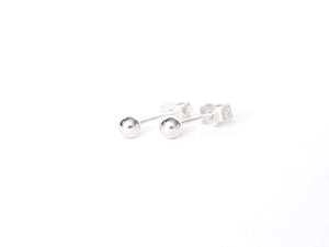 Dew-drop-silver-bead-stud-earrings-by-Marie-Beatrice-Gade-on-white-background