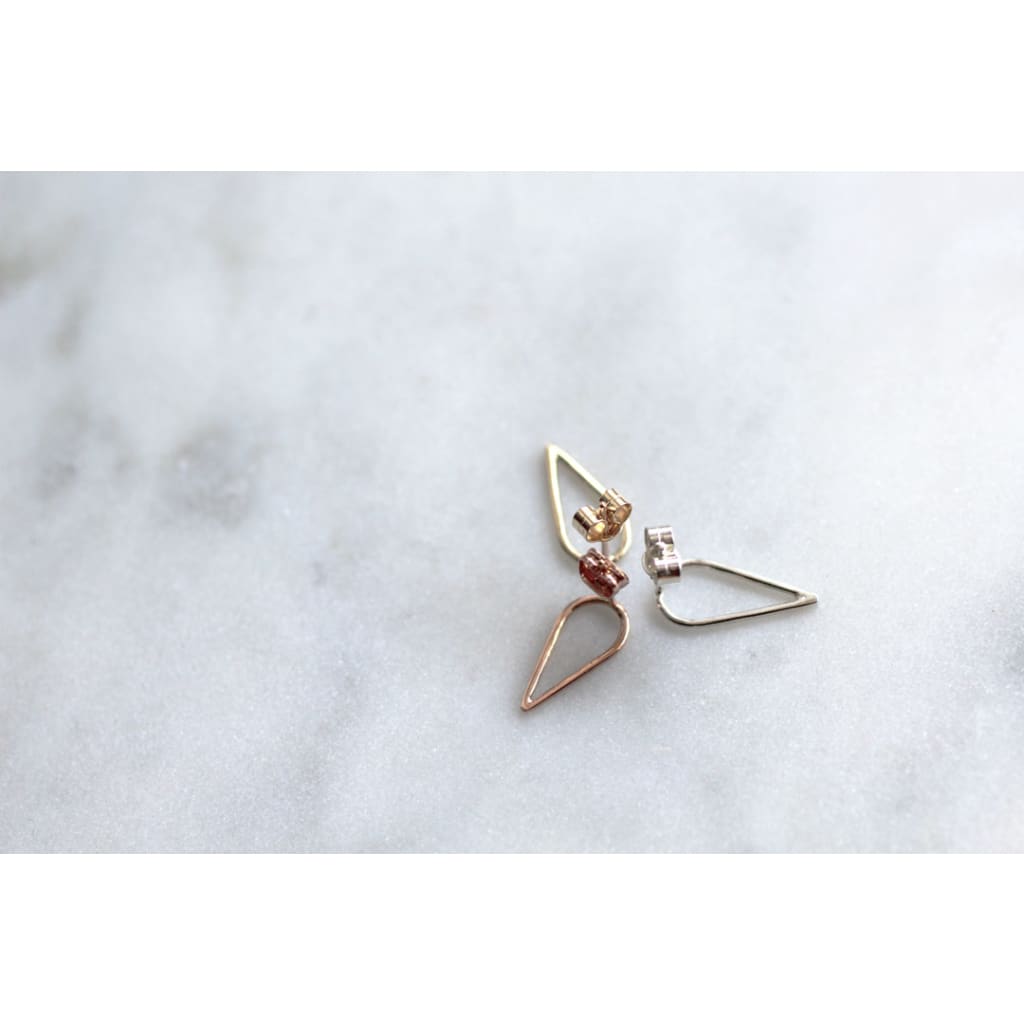 Filippa Arrow earrings in silver recycled red gold and recycled gold by M of Copenhagen
