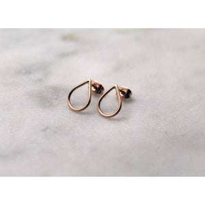 Filippa Minis in 9 ct red gold by M of Copenhagen laid out on marble