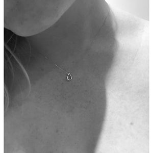 Filippa small drop necklace by M of Copenhagen shown on models neck