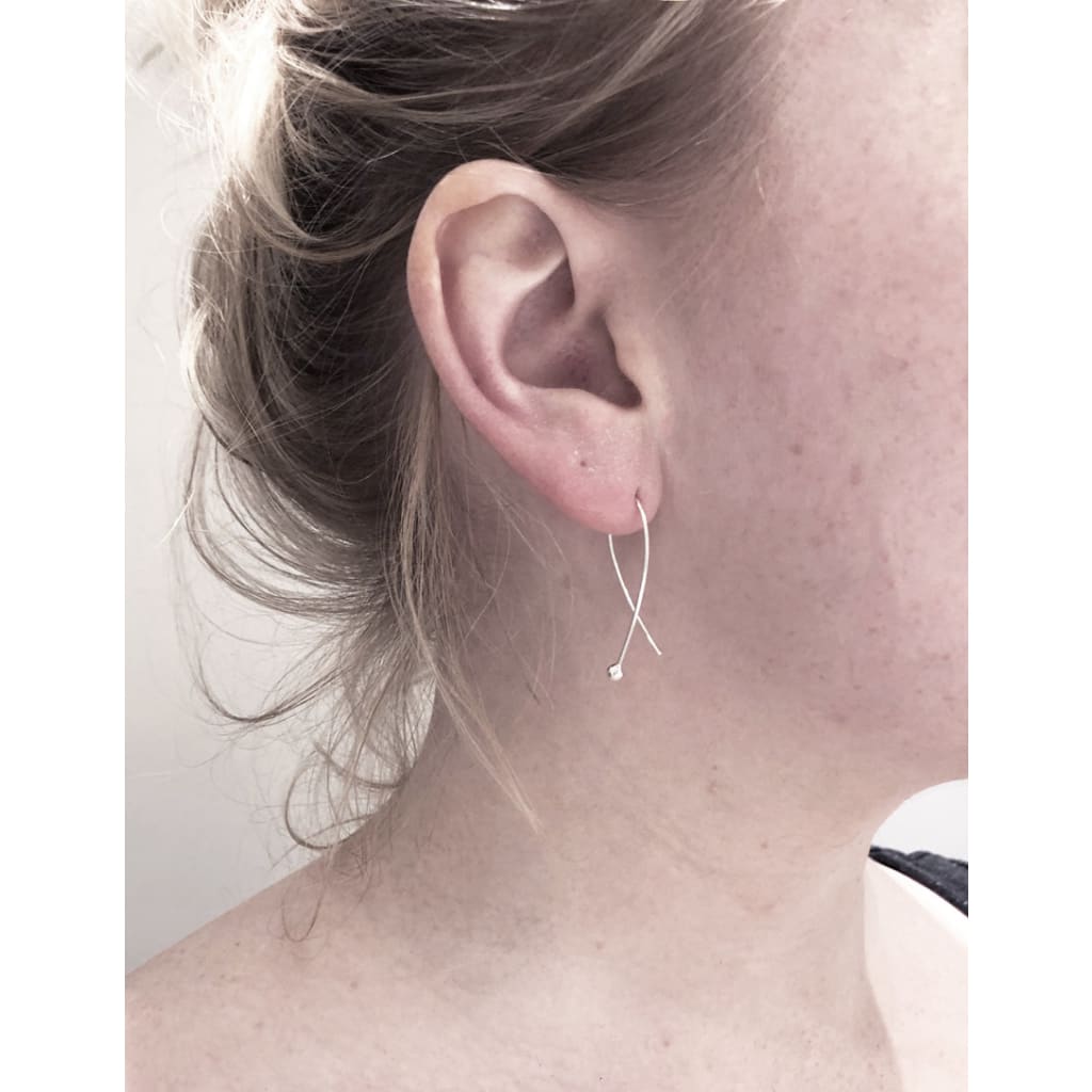 Gabrielle earrings in recycled silver by m of Copenhagen eco jeweller on model