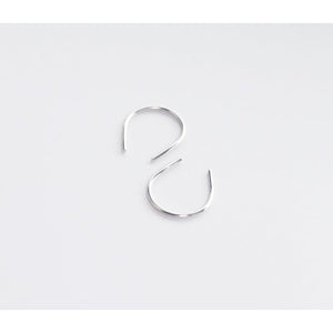 Hook recycled sterling silver earrings by eco jeweller M of Copenhagen flatlay white background