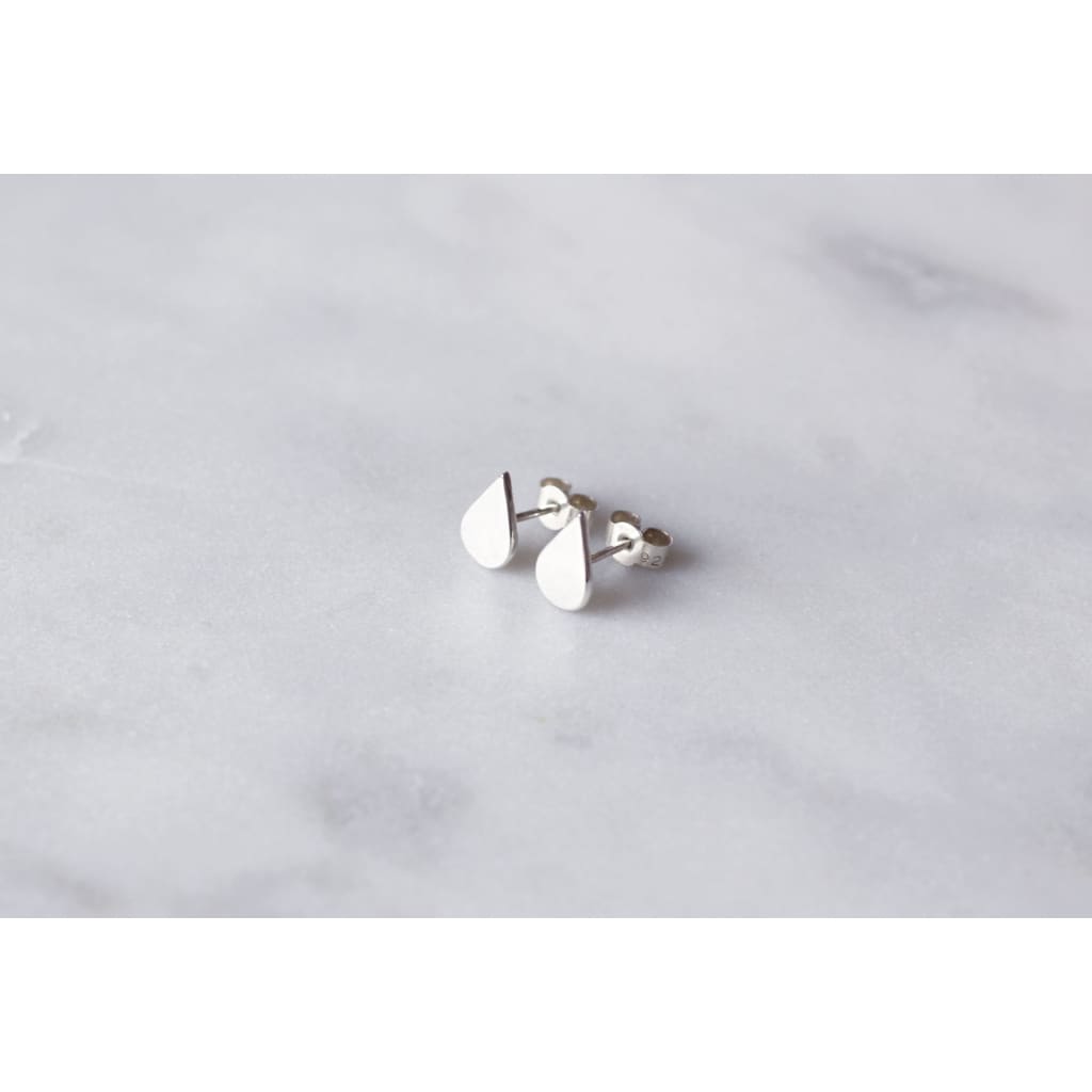 Laguna earrings by M of Copenhagen shown on marble surface