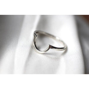 U shaped ring by M of Copenhagen on white silk