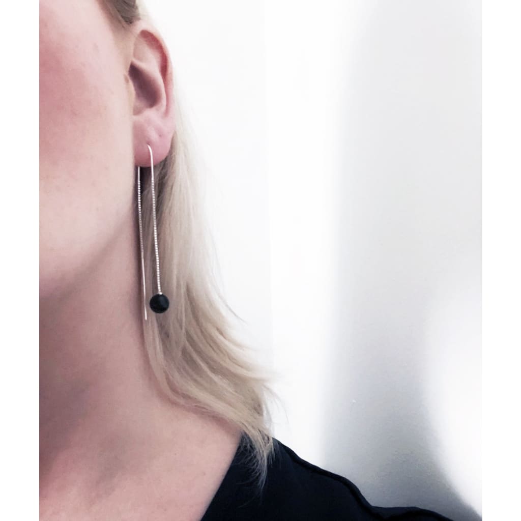 Zero waste Orbit earrings by M of Copenhagen shown on model