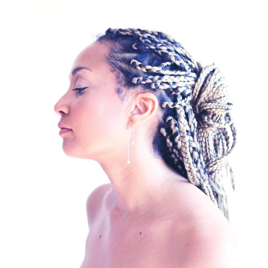 Rain earrings by M of Copenhagen made from recycled silver on model
