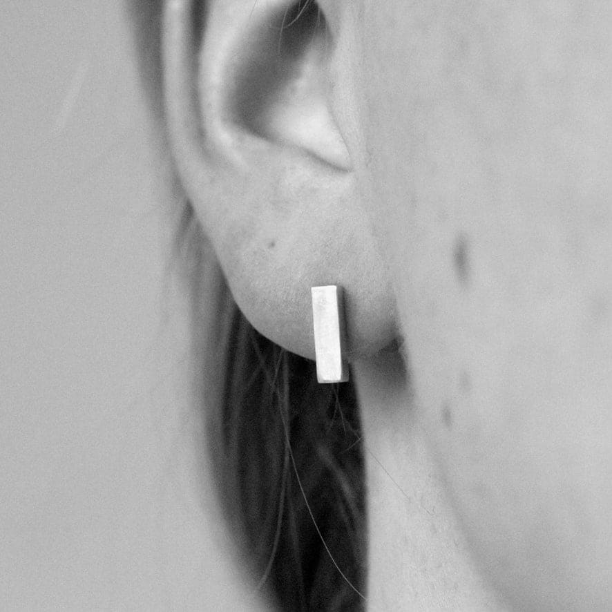 Rectangle earrings by M of Copenhagen shown on model