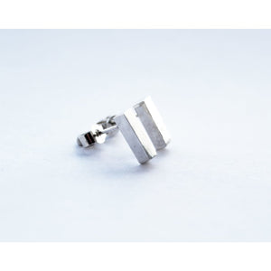 Rectangle earrings by M of Copenhagen made from sterling silver on white background