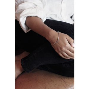 Thy bangle by M of Copenhagen made from recycled silver shown on model