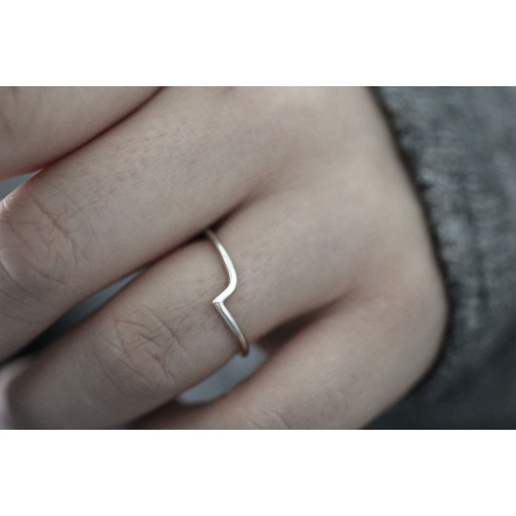 Thy ring by M of Copenhagen made from recycled silver shown on hand