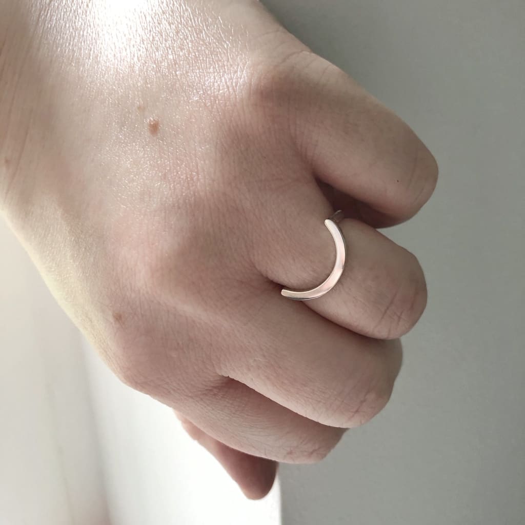 Uno unisex curved U shaped ring in recycled silver by M of Copenhagen on hand 