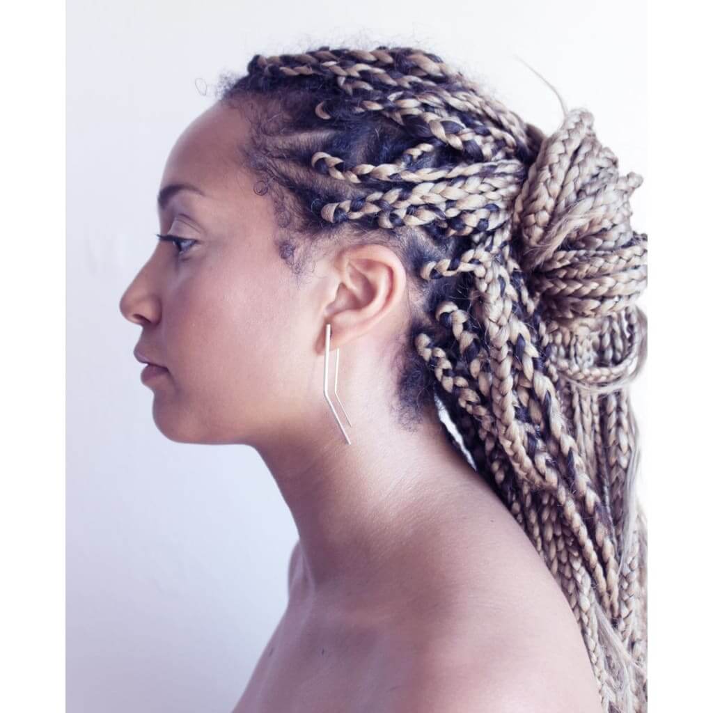 Vixen earrings by M of Copenhagen made with recycled silver shown on model