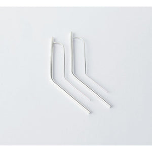 Vixen earrings by M of Copenhagen made with recycled silver flat lay on white background