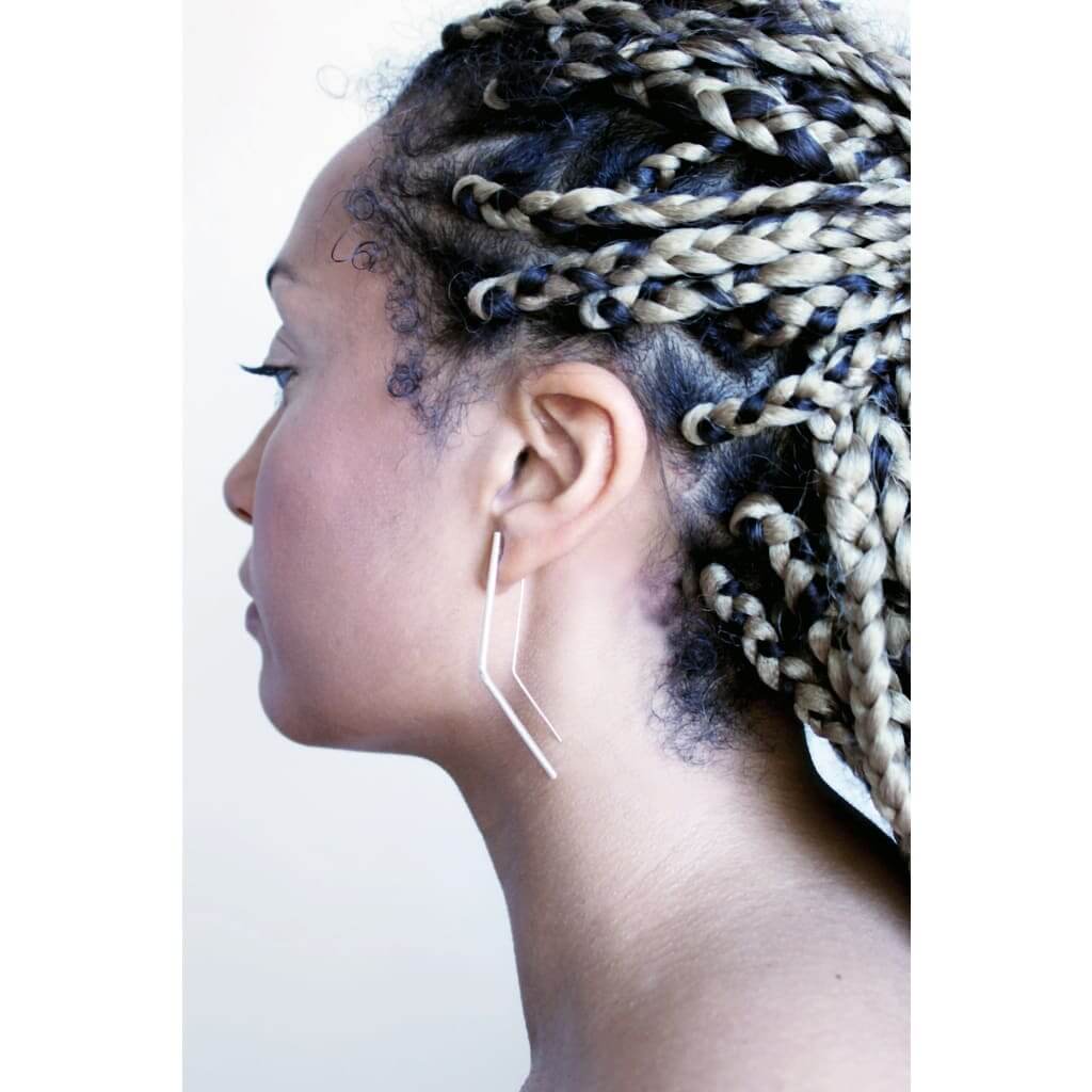 Vixen earrings by M of Copenhagen made with recycled silver shown on model